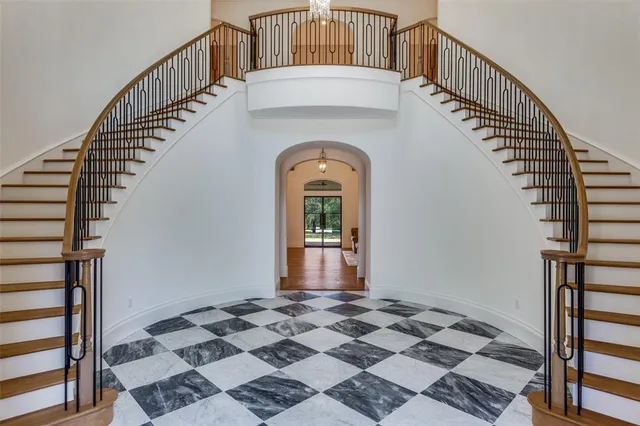 a view of a hallway with a front door