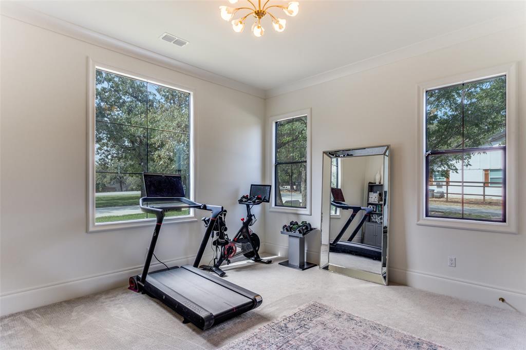 1133 Bourland Road Keller, TX 76248 - Photo 25 of 39 a view of a room with gym equipment
