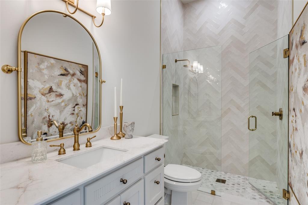 1133 Bourland Road Keller, TX 76248 - Photo 26 of 39 a bathroom with a sink toilet and shower