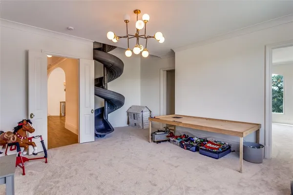 a bedroom with furniture and a chandelier