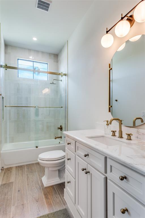 1133 Bourland Road Keller, TX 76248 - Photo 32 of 39 a bathroom with a sink a toilet and a mirror