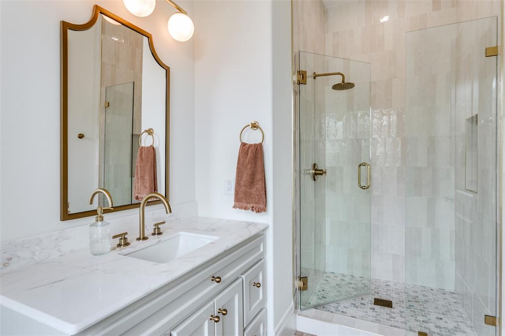 1133 Bourland Road Keller, TX 76248 - Photo 33 of 39 a bathroom with a double vanity sink shower and a mirror