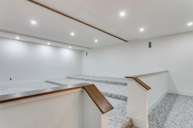 a bathroom with a granite countertop sink and a bathtub