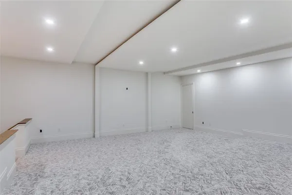 an empty room with white walls
