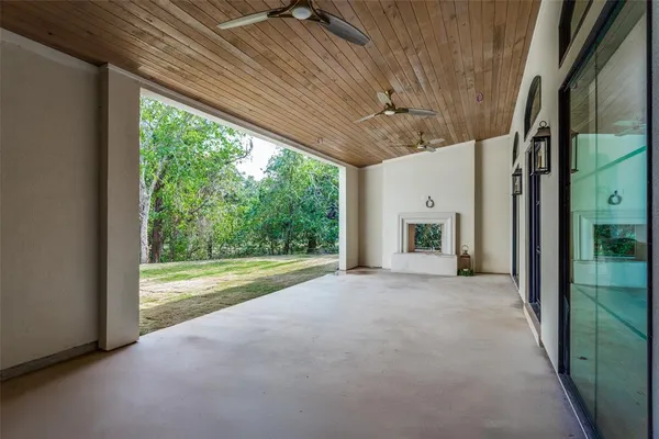 a view of a room with a large bed and large windows