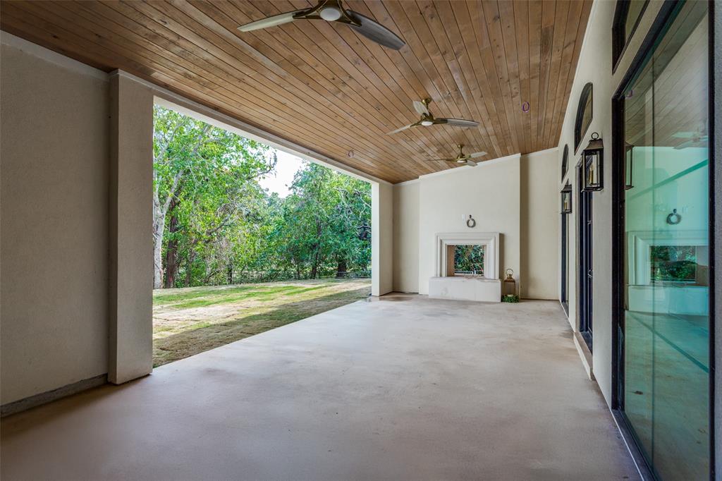 1133 Bourland Road Keller, TX 76248 - Photo 38 of 39 a view of a room with a large bed and large windows