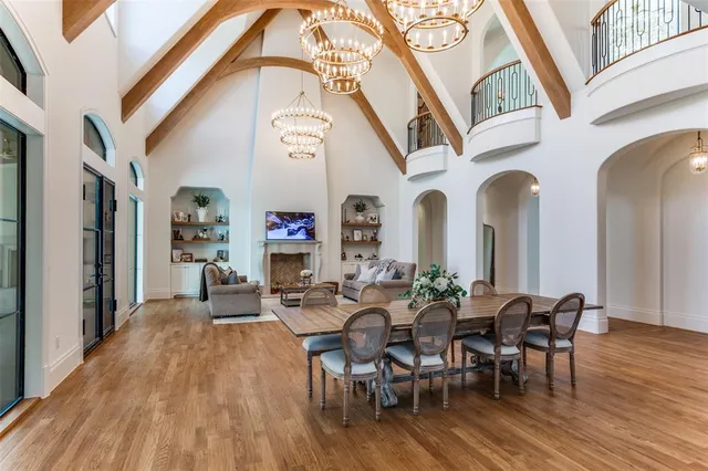 a view of a dining room with furniture wooden floor and chandelier