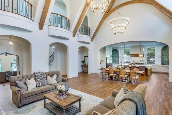 a living room with furniture fireplace and dining table