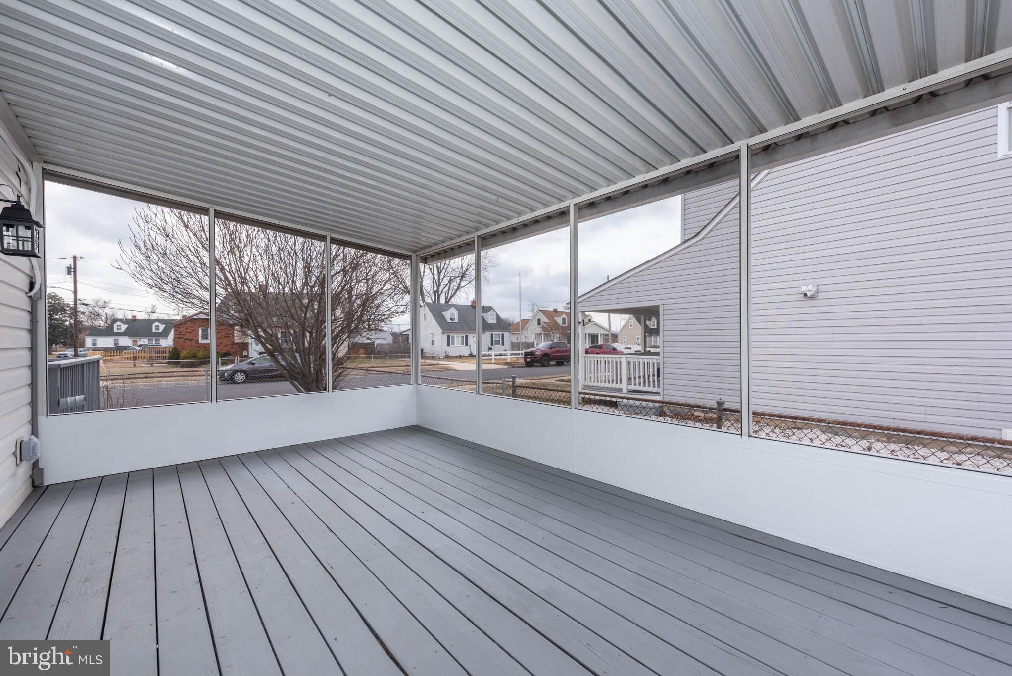 8106 Murray Point Road Dundalk, MD 21222 - Photo 27 of 32 a view of a porch with wooden floor