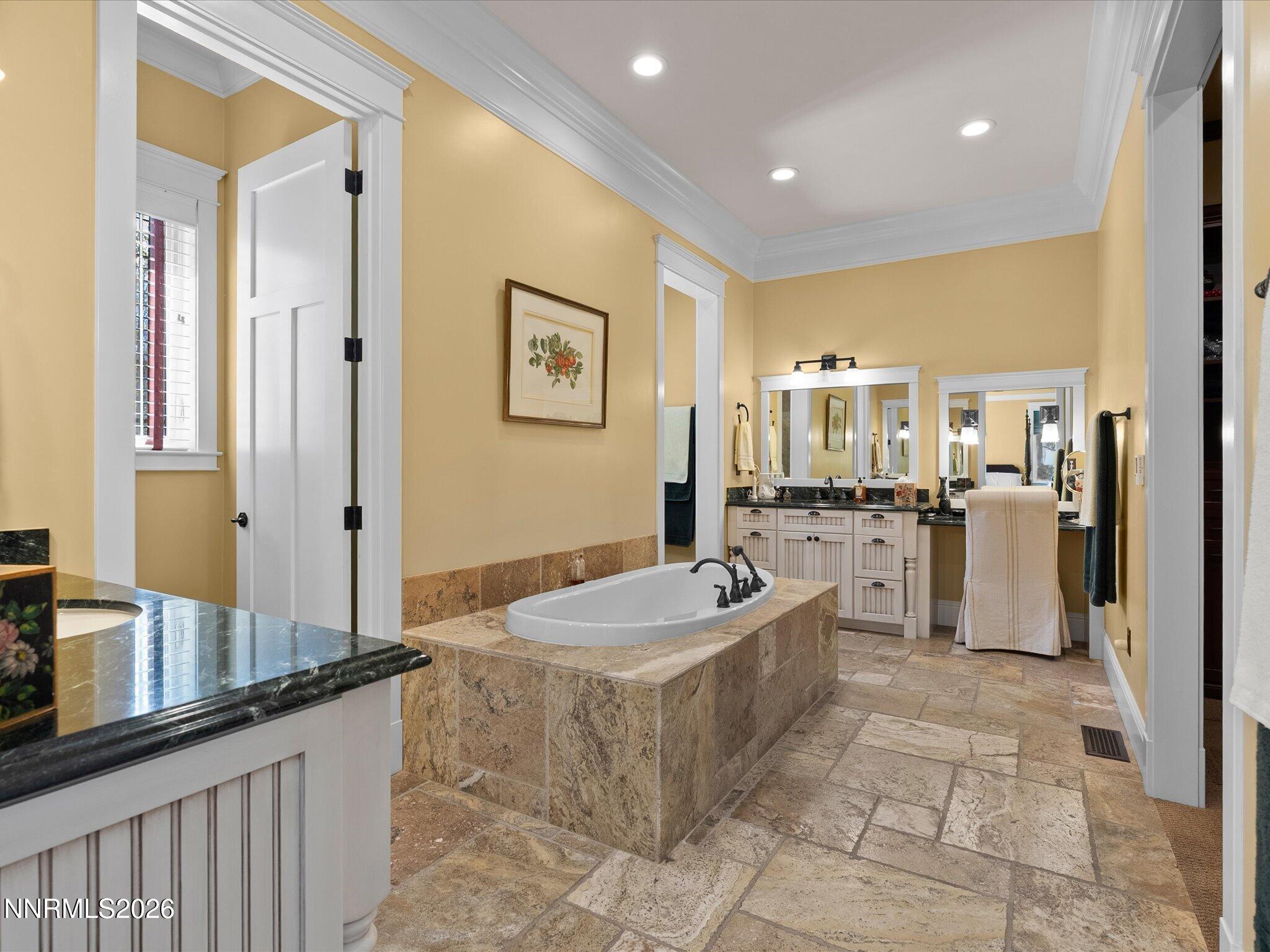 201 South Argyle Court Reno, NV 89511 - Photo 35 of 95 a spacious bathroom with a double vanity sink a mirror and a bathtub