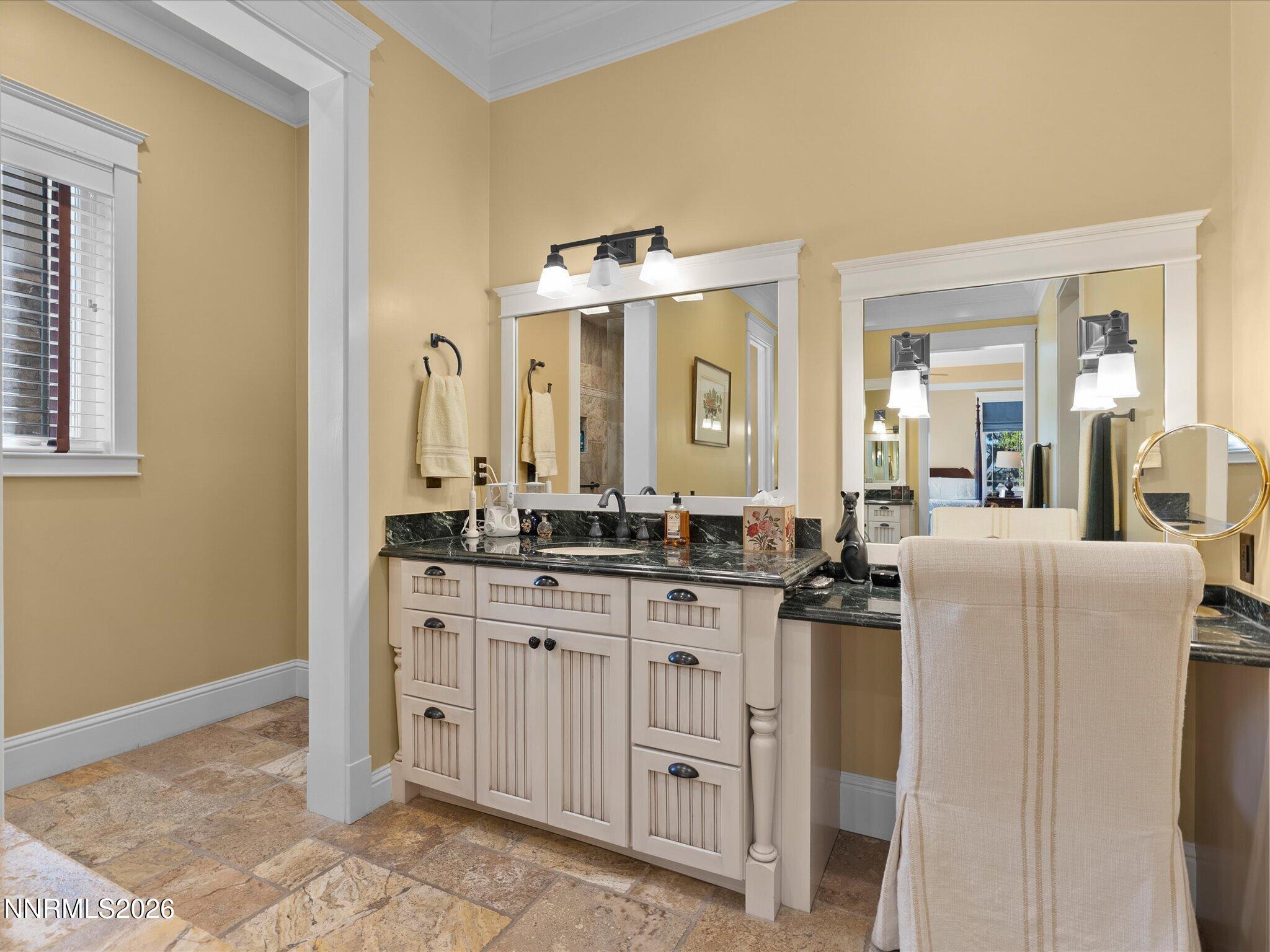 201 South Argyle Court Reno, NV 89511 - Photo 37 of 95 a spacious bathroom with a granite countertop sink and a mirror
