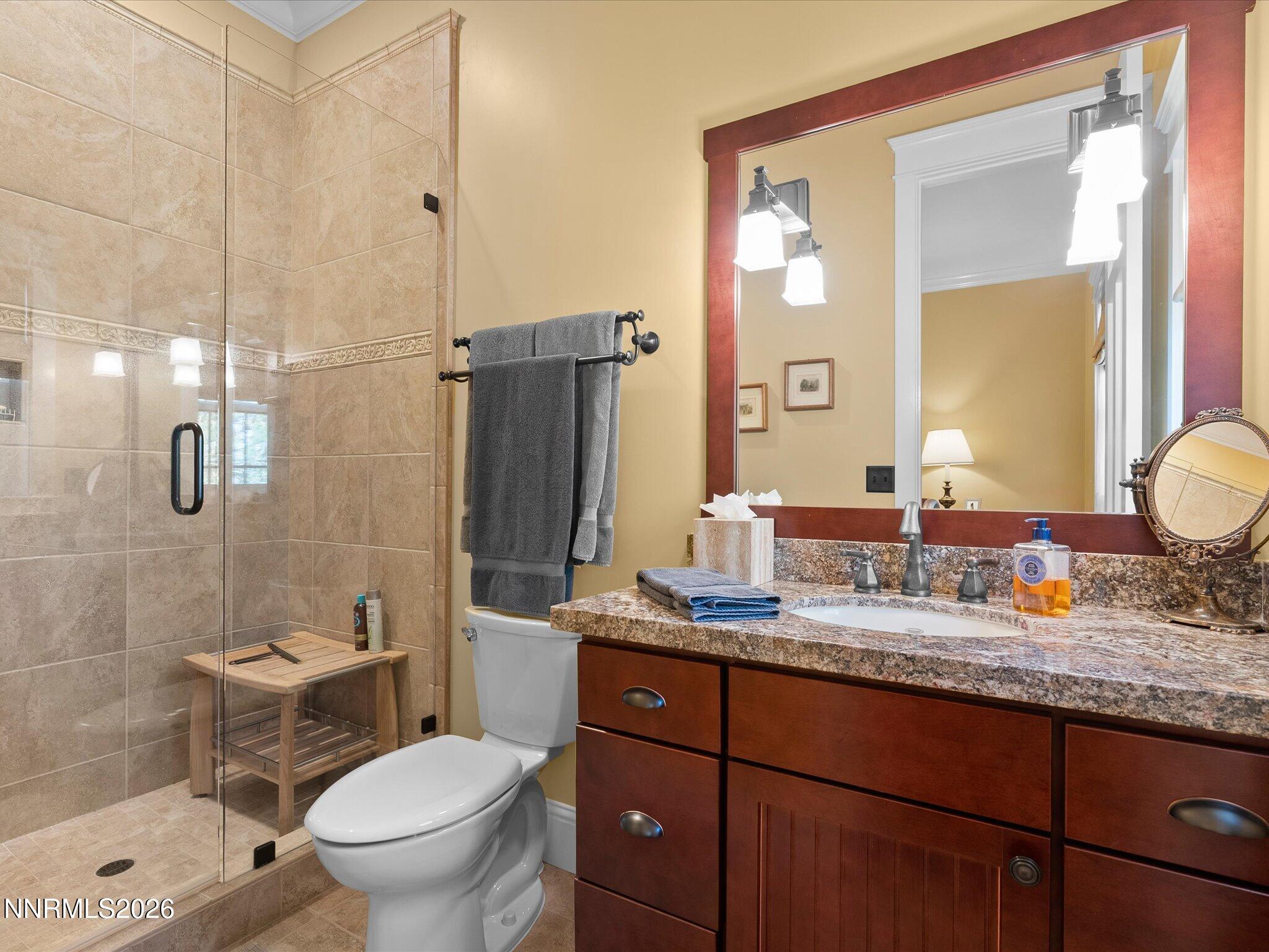 201 South Argyle Court Reno, NV 89511 - Photo 48 of 95 a bathroom with a granite countertop sink toilet and shower