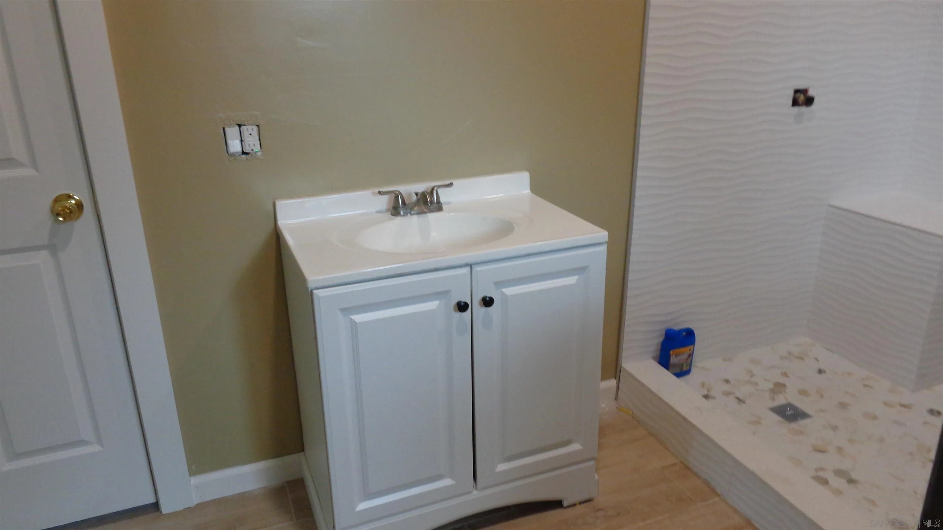29660 Wilkes Road Valley Center, CA 92082 - Photo 12 of 16 a bathroom with a tub sink and vanity