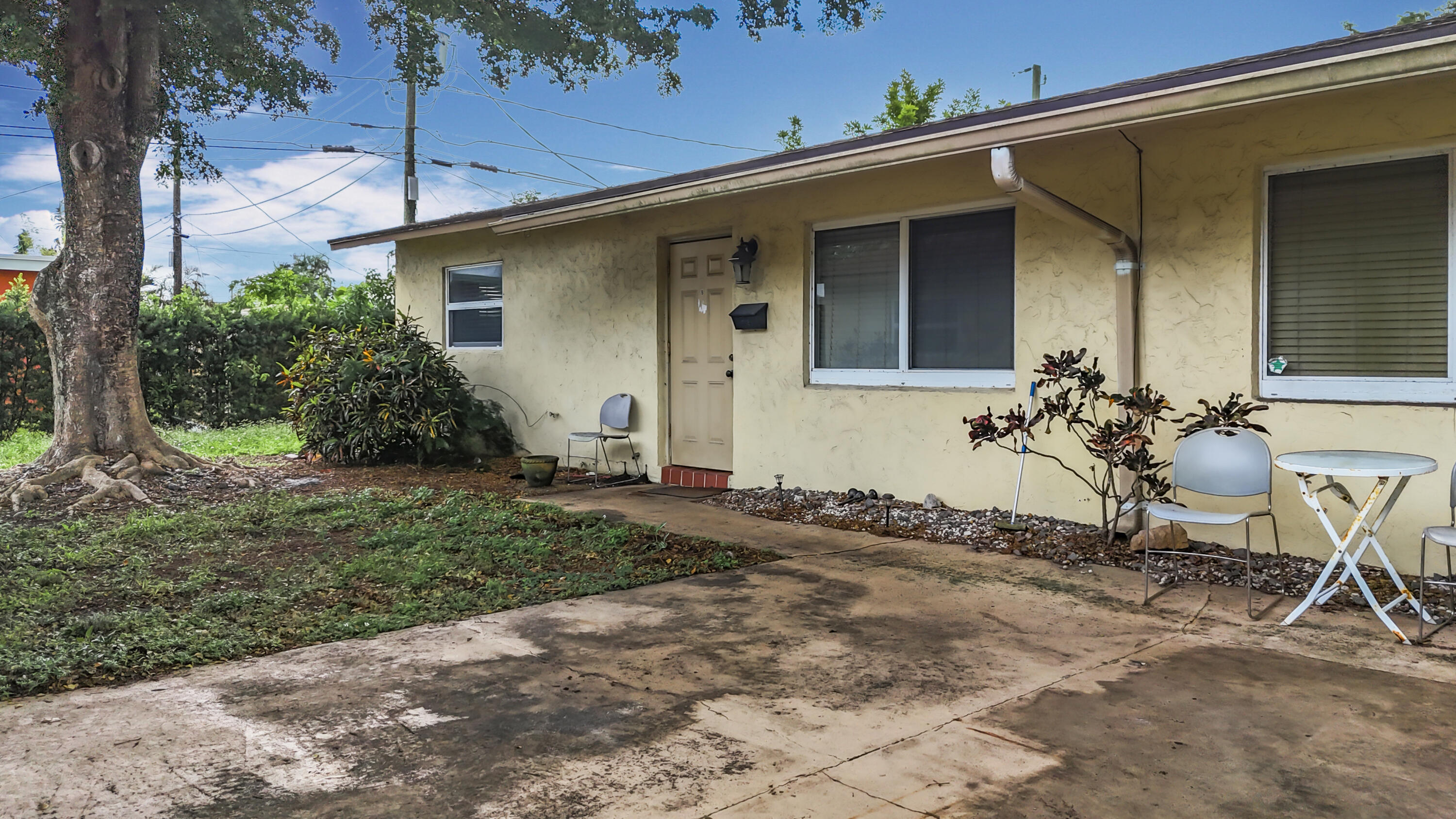 408 Northeast 12th Avenue, Unit 2 Pompano Beach, FL 33060 - Photo 14 of 14 a view of house with backyard space and garden