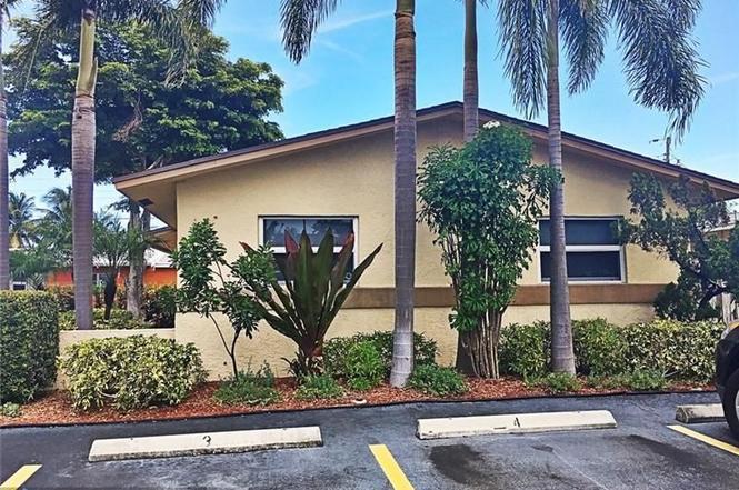 408 Northeast 12th Avenue, Unit 2 Pompano Beach, FL 33060 - Photo 2 of 14 front view of a house with a street