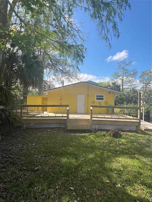 7222 Tropical Drive Weeki Wachee, FL 34607 - Photo 2 of 23 a view of a back yard of the house