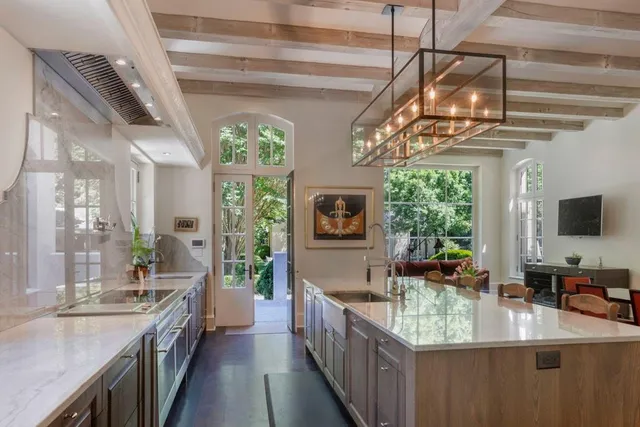 a kitchen with kitchen island granite countertop lots of counter top space