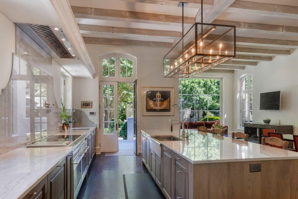 133 Blackland Road Northwest Atlanta, GA 30342 - Photo 13 of 38 a kitchen with kitchen island granite countertop lots of counter top space