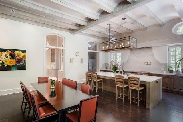 a view of a dining room with furniture wooden floor and chandelier