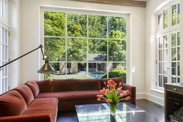 a work room with furniture and a potted plant
