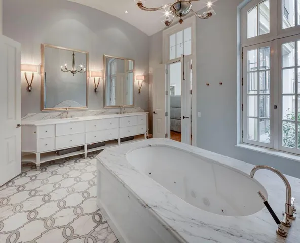 a bathroom with a bathtub and a shower