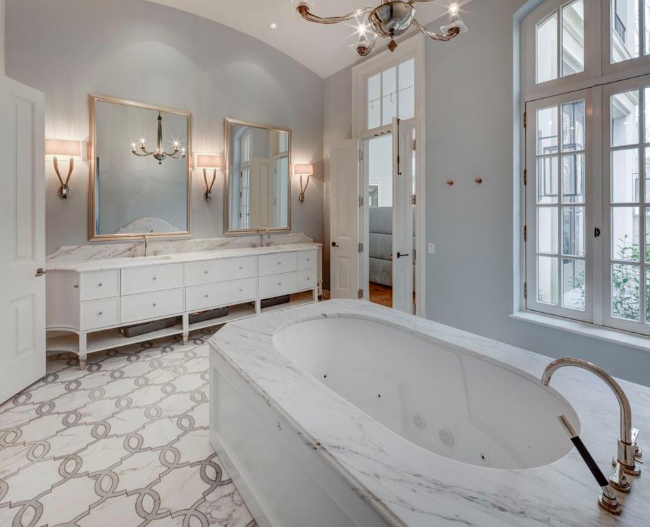 133 Blackland Road Northwest Atlanta, GA 30342 - Photo 18 of 38 a bathroom with a bathtub and a shower
