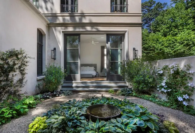 a view of house with patio outdoor seating area and entertaining space