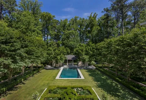 a view of a swimming pool with a yard
