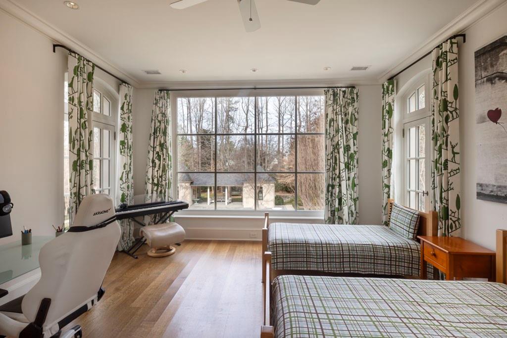 133 Blackland Road Northwest Atlanta, GA 30342 - Photo 24 of 38 a bedroom with furniture and a window