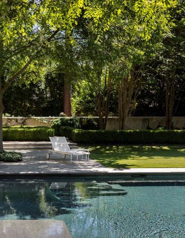 a view of swimming pool with a yard