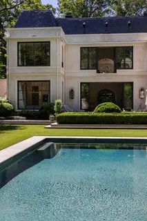 a view of house with swimming pool