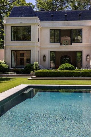 a view of house with swimming pool
