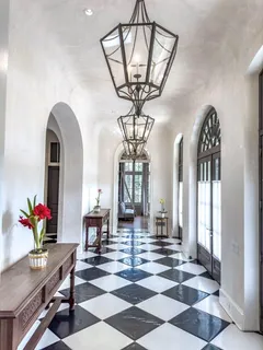 a view of hall way with furniture