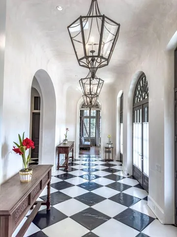 a view of hall way with furniture