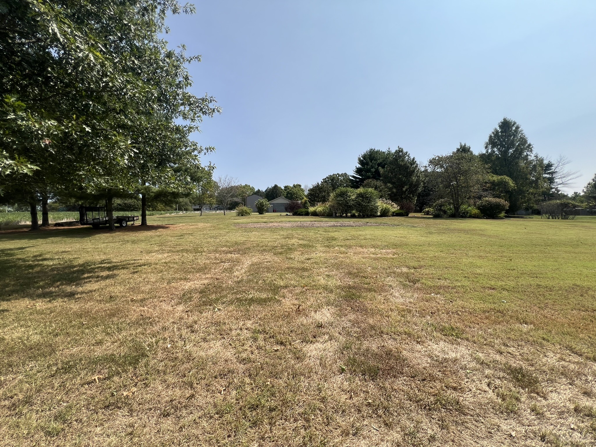 676 Old Gallatin Road Portland, TN 37148 - Photo 18 of 54 a view of a green field with trees in the background