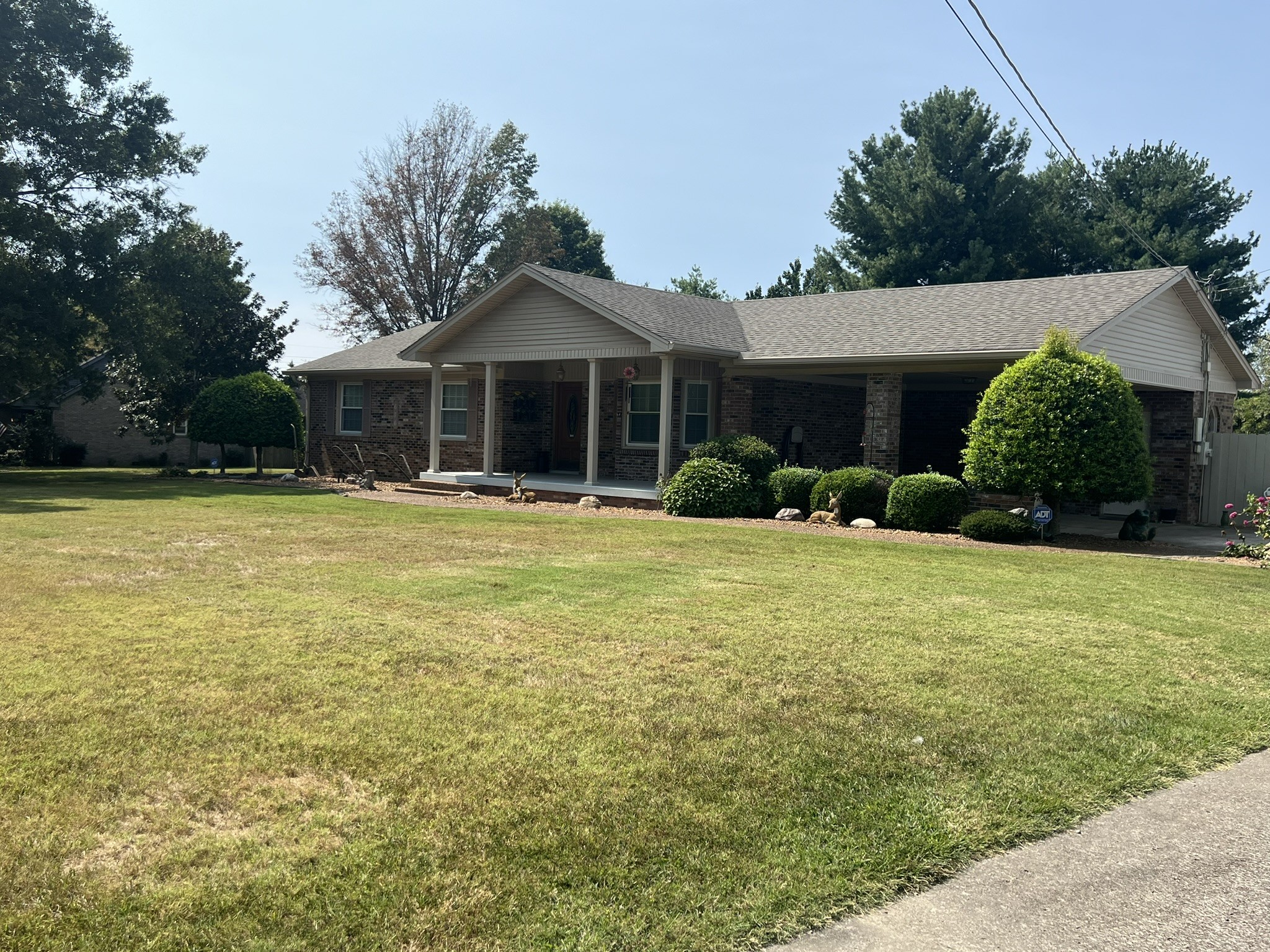 676 Old Gallatin Road Portland, TN 37148 - Photo 3 of 54 a front view of a house with a yard and garage