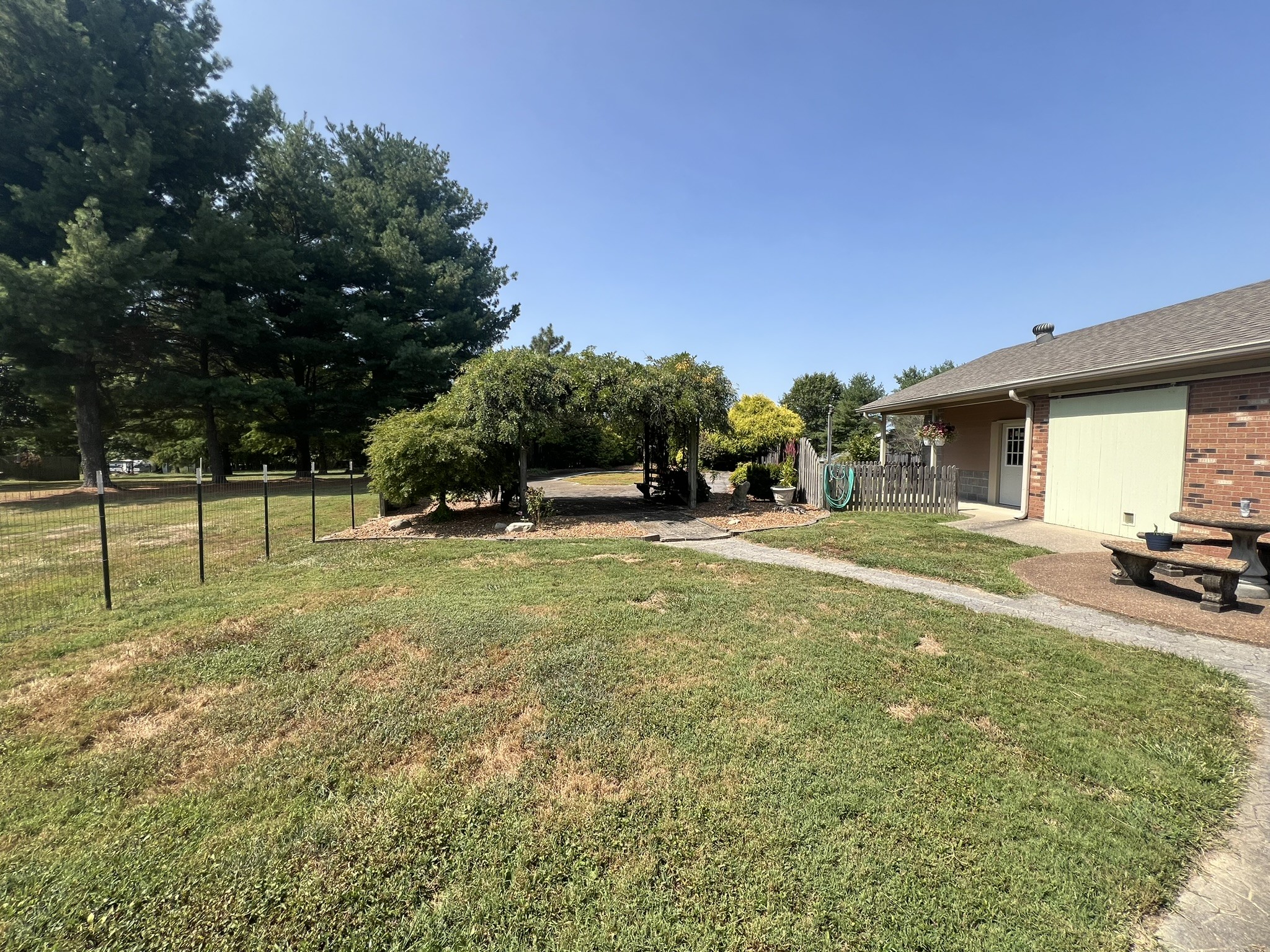 676 Old Gallatin Road Portland, TN 37148 - Photo 37 of 54 a view of a house with backyard and trees