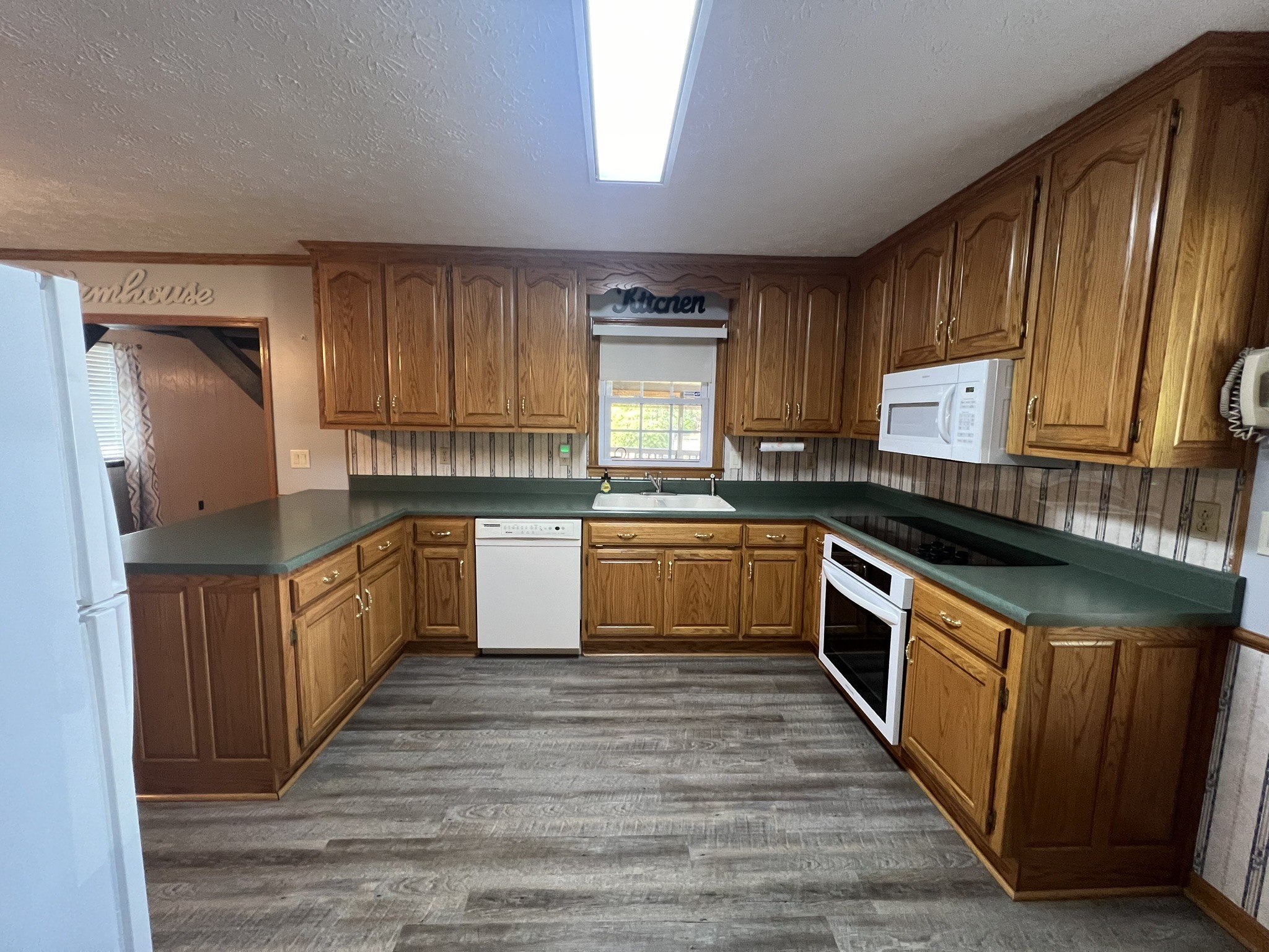 676 Old Gallatin Road Portland, TN 37148 - Photo 41 of 54 a kitchen with a sink stove top oven and cabinets
