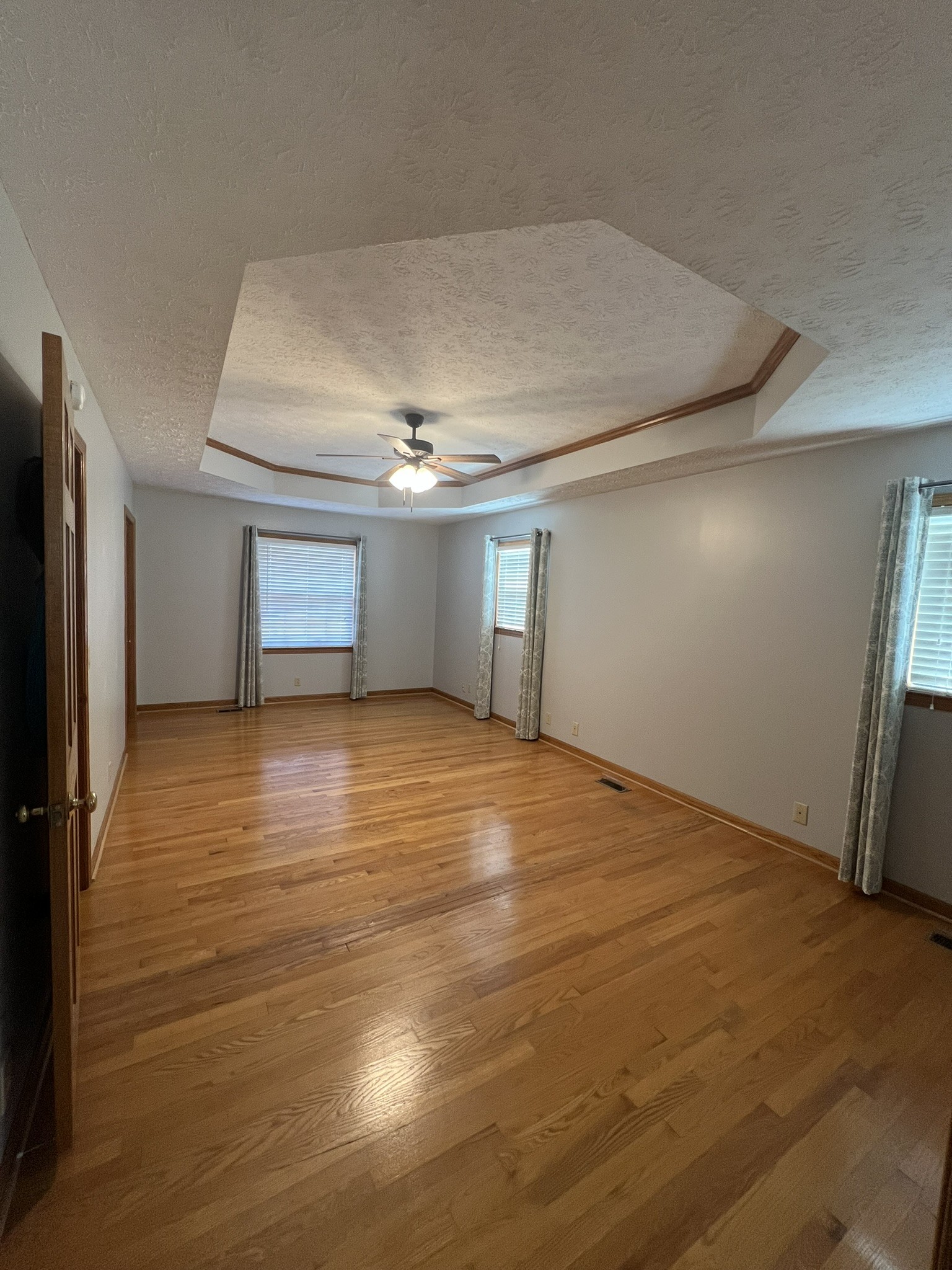 676 Old Gallatin Road Portland, TN 37148 - Photo 49 of 54 a view of empty room with wooden floor and fan