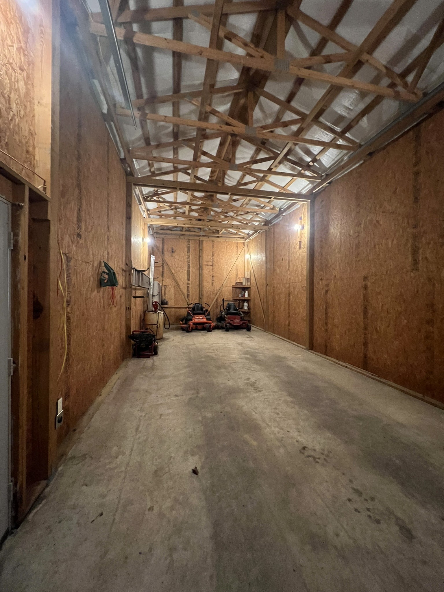 676 Old Gallatin Road Portland, TN 37148 - Photo 6 of 54 a view of hallway with a refrigerator a mirror and a window