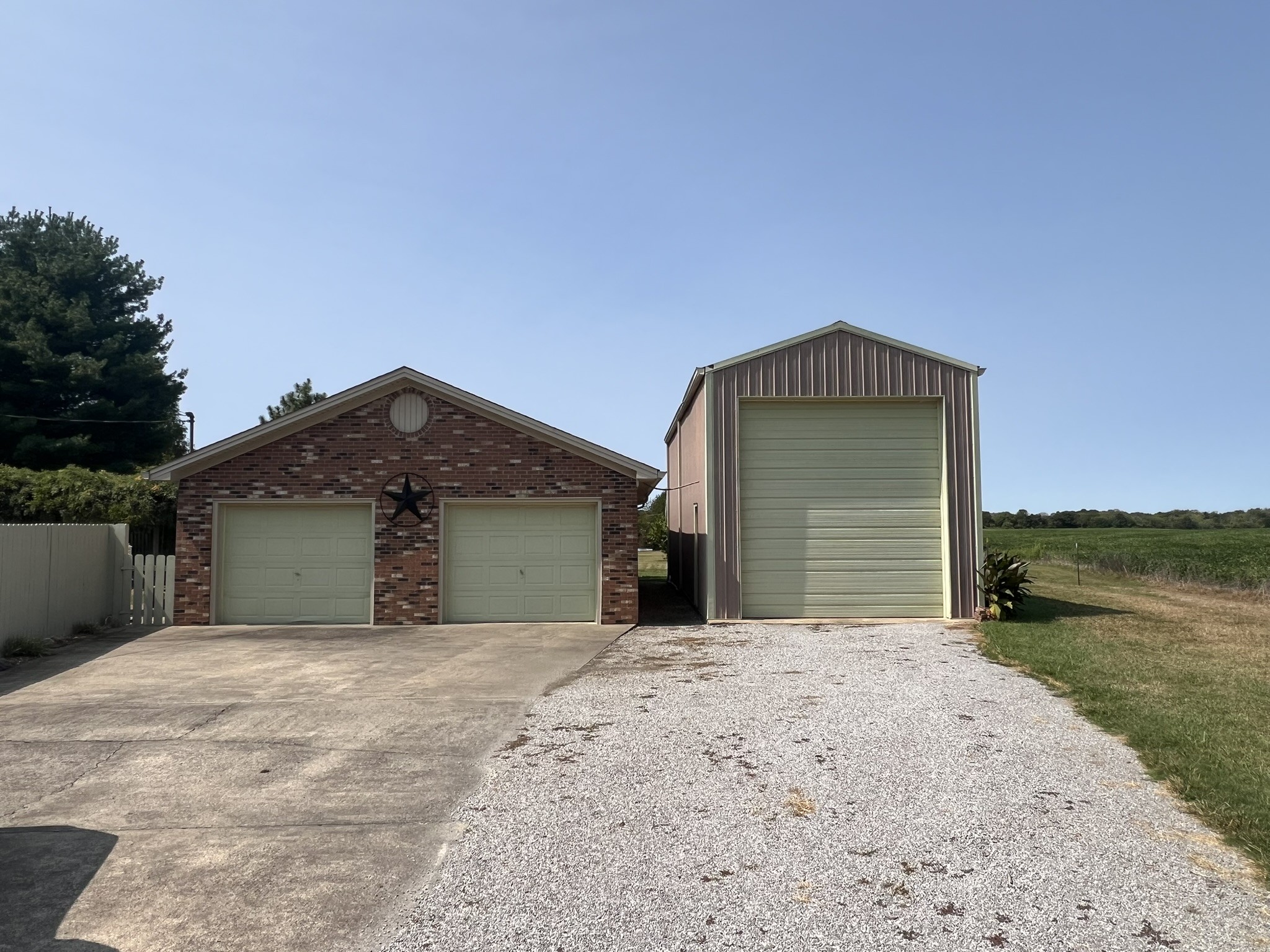 676 Old Gallatin Road Portland, TN 37148 - Photo 8 of 54 a front view of a house with a yard and garage