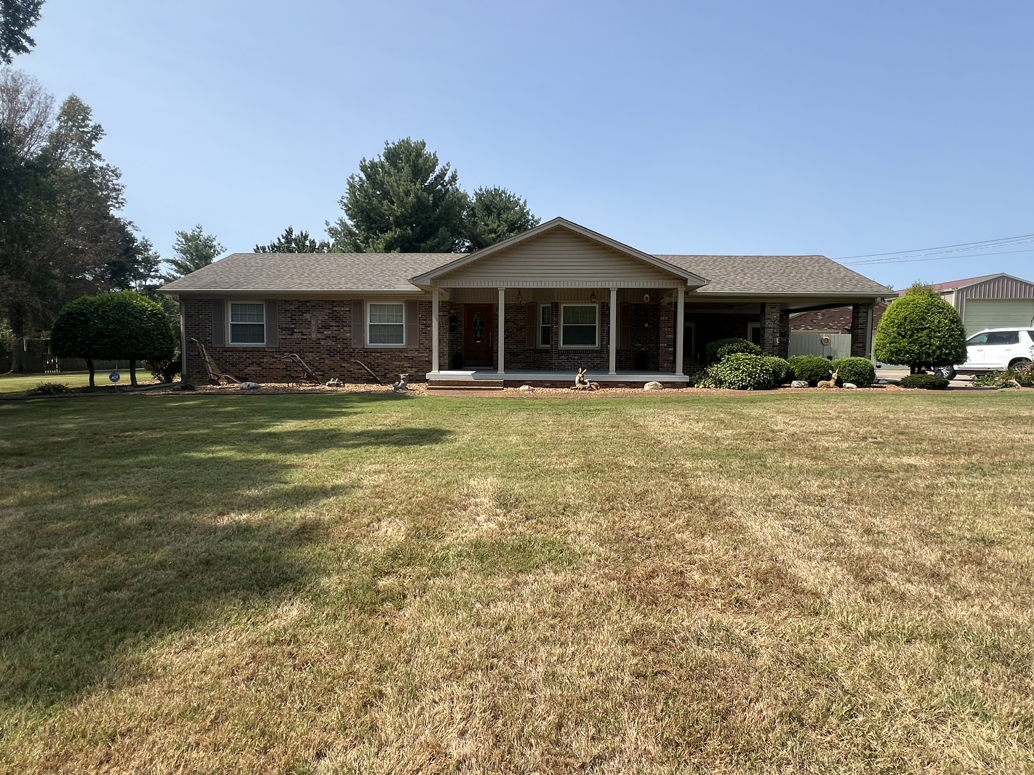 676 Old Gallatin Road Portland, TN 37148 - Photo 9 of 54 a front view of a house with a yard