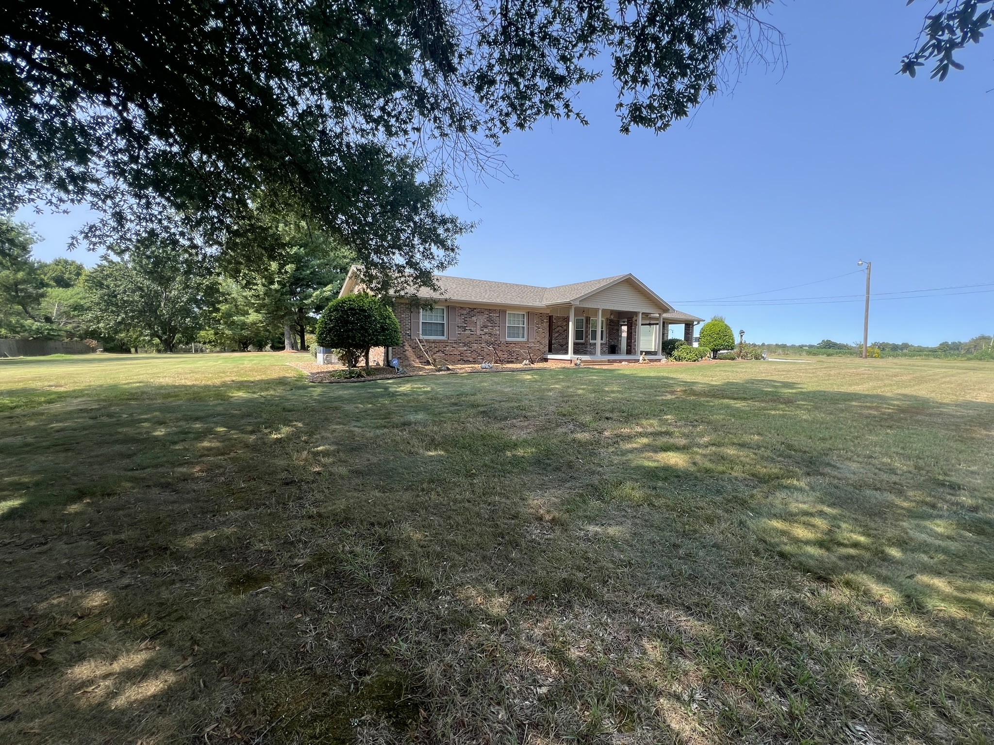 676 Old Gallatin Road Portland, TN 37148 - Photo 10 of 54 a big yard with large trees and a big yard