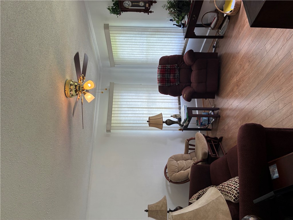 3407 New Pond Road Anderson, SC 29626 - Photo 3 of 16 Hardwood-style flooring and overhead illumination create a welcoming, open atmosphere for comfortable gatherings.