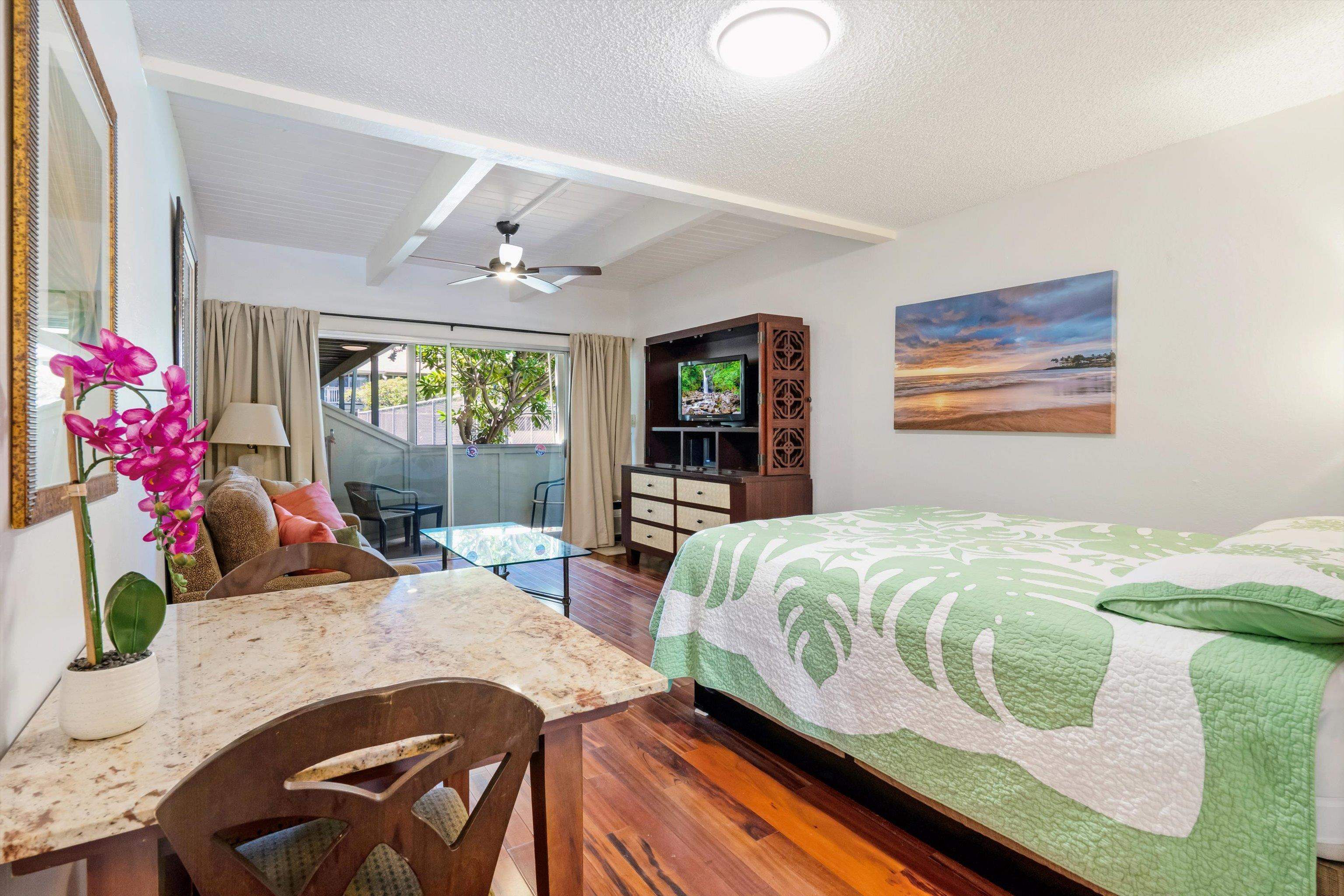 715 South Kihei Road, Unit B 120 Kihei, HI 96753 - Photo 12 of 36 a bedroom with a bed and wooden floor