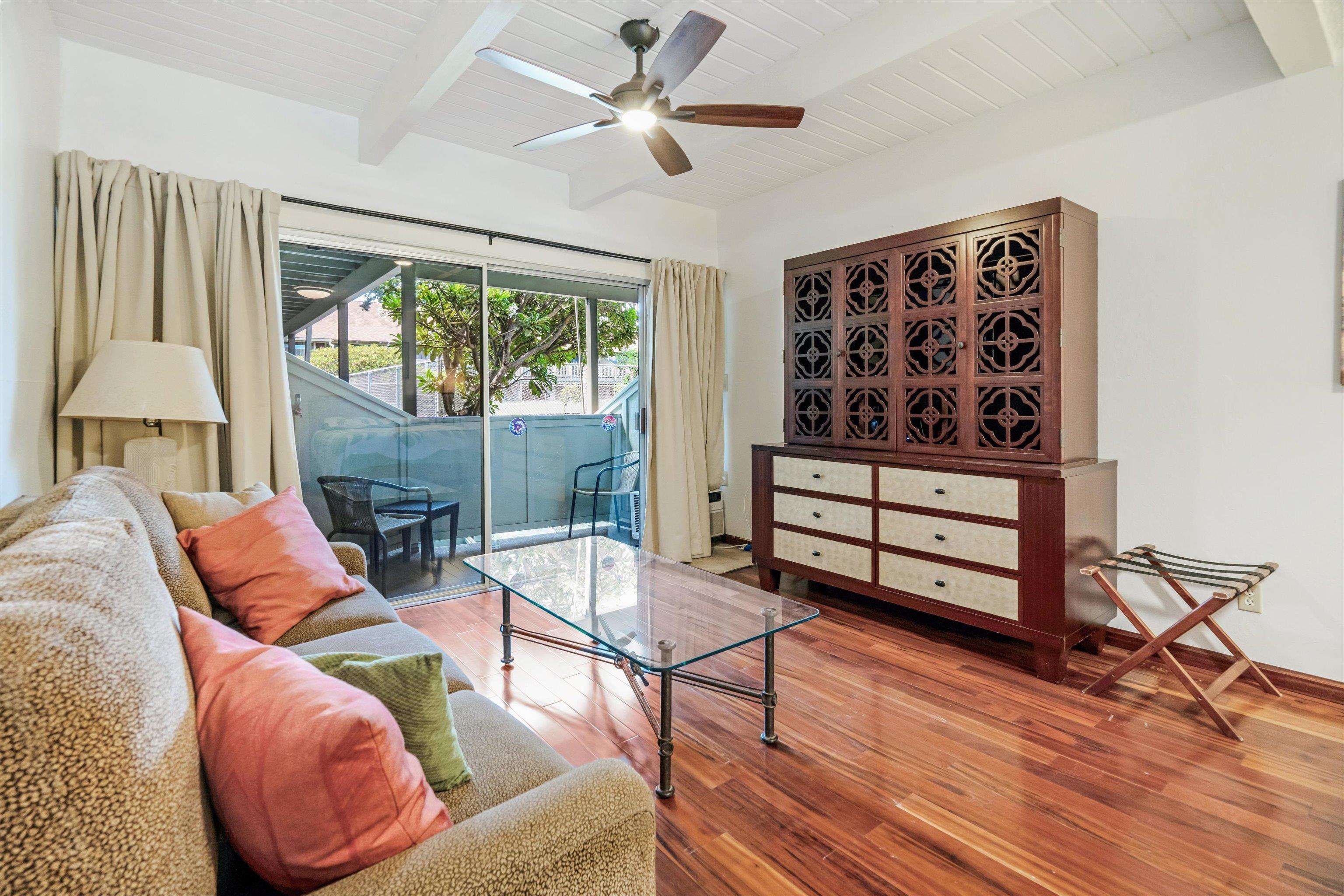 715 South Kihei Road, Unit B 120 Kihei, HI 96753 - Photo 7 of 36 a living room with furniture a window and a flat screen tv