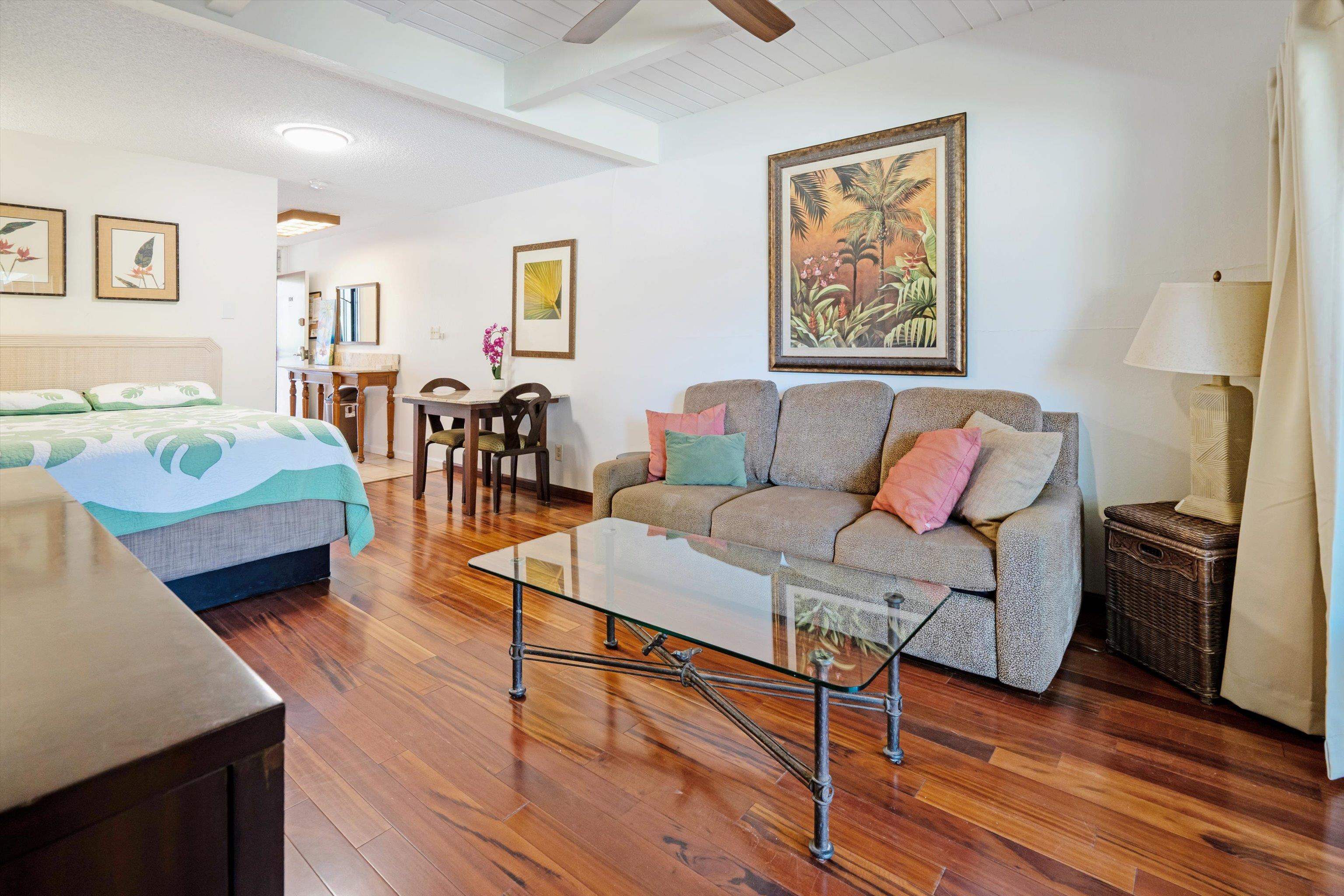 715 South Kihei Road, Unit B 120 Kihei, HI 96753 - Photo 9 of 36 a living room with furniture and wooden floor