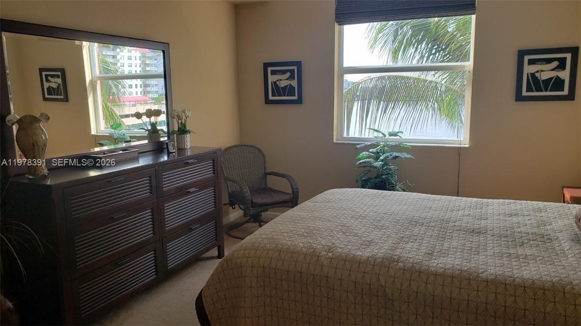 17150 North Bay Road, Unit 2406 Sunny Isles Beach, FL 33160 - Photo 15 of 22 a bedroom with a bed and a window