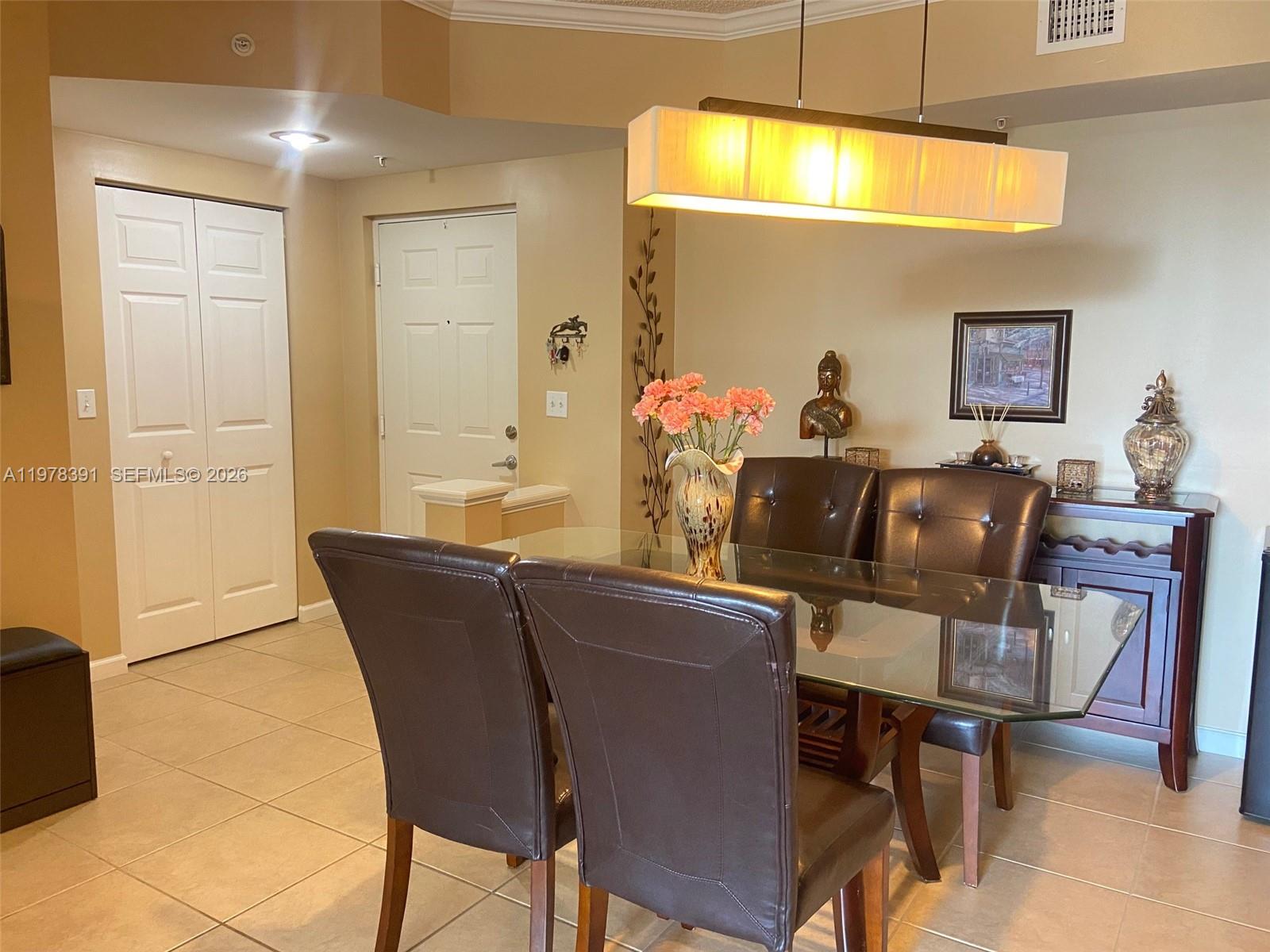 17150 North Bay Road, Unit 2406 Sunny Isles Beach, FL 33160 - Photo 10 of 22 a living room with furniture and a window