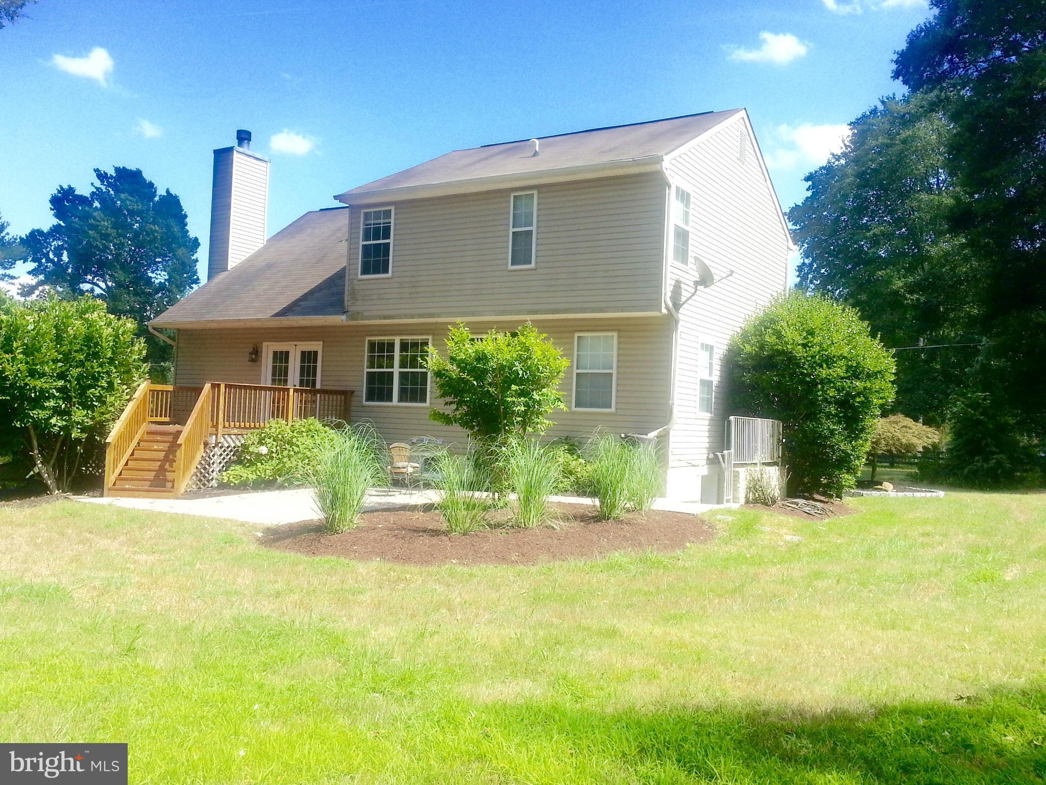 16313 Manning Road West Accokeek, MD 20607 - Photo 7 of 8 a front view of a house with a yard